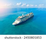 Concept for vacation and travel with a generic cruise ship sailing over the calm ocean. Luxury cruise. 