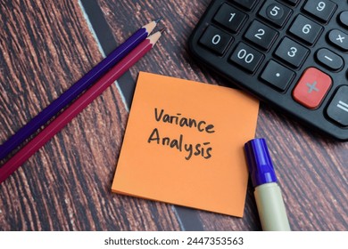 Concept of Variance Analysis write on sticky notes isolated on Wooden Table.