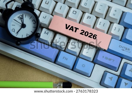 Concept of vat 2026 write on sticky notes isolated on Wooden Table. For tax deadlines and planning