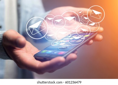 Concept view of sending email on smartphone interface with message icon around - Shutterstock ID 601236479