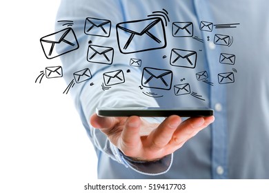 Concept view of sending message with smartphone with email icon around - Shutterstock ID 519417703