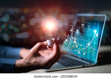 Concept of virtual diagram,graph interfaces,digital display,connections,stock trade market.Male hands typing on dock keyboard contemporary electronic tablet.Blurred city bokeh background. Horizontal - Shutterstock ID 2202588559