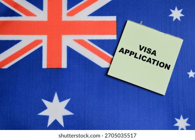 Concept of visa application write on sticky notes with Australia flag.