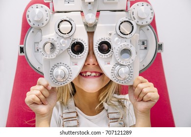 concept vision testing. child girl with eyeglasses