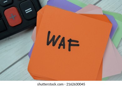 Concept Of WAF - Web Application Firewall Write On Sticky Notes Isolated On Wooden Table. Selective Focus On WAF Text