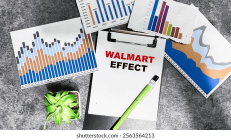 Concept of Walmart Effect write on paperwork isolated on Wooden Table.