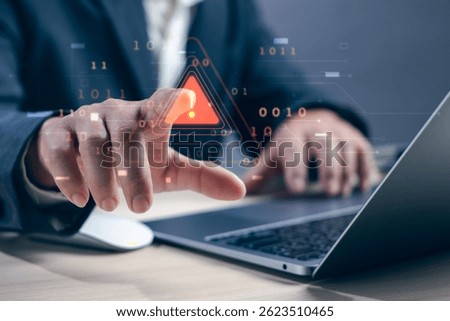 Concept of warning or alert, notification, technology crime,businessman hand working on laptop touching warning about access to software, virus,dangerous cyber attack or online network hacking threat.