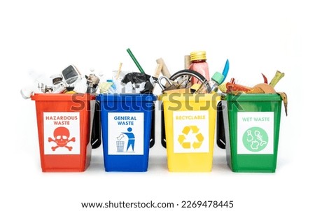 The concept of waste classification for recycling. Collection of waste bins full of different types of garbage in separation according to the color of the bin isolated on white background.
