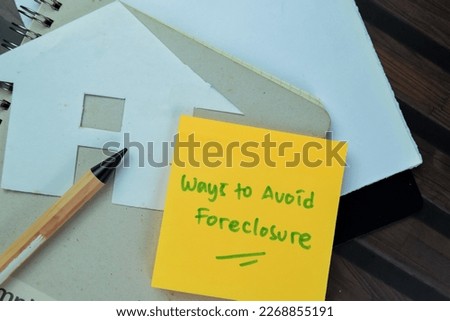 Concept of Ways to Avoid Foreclosure write on sticky notes isolated on Wooden Table.
