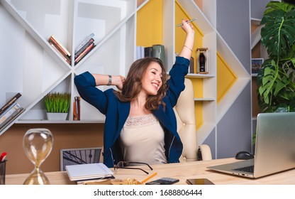 Concept: We Return To Work In The Office, The End Of Quarantine. Successful Business Woman Rejoices In Return To Office Work