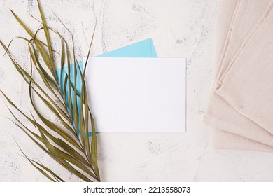 The Concept Of Wedding Invitation Cards, Dinner Invitations, Offices And Others. Blank Paper And Envelope, With White Cement Background.