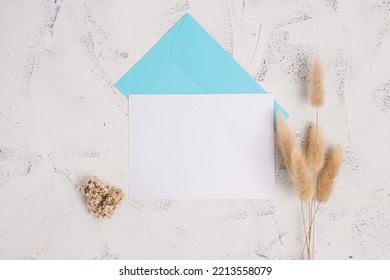 The Concept Of Wedding Invitation Cards, Dinner Invitations, Offices And Others. Blank Paper And Envelope, With White Cement Background.