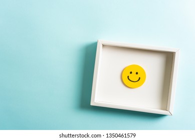 Concept of well done sign emoji, feedback, employee recognition award. happy yellow smiling cartoon face frame on blue background. - Powered by Shutterstock