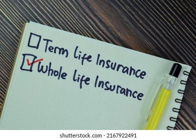 Concept of Whole Life Insurance write on a book isolated on Wooden Table. - Shutterstock ID 2167922491