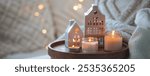 Concept of winter Christmas home aromatherapy, cozy bedroom interior, place for relaxation, detention, meditation. Bamboo tray, burning aromatic organic natural soy candles, sweet vanilla scent banner