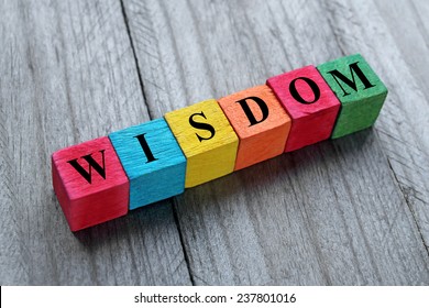 Concept Of Wisdom Word On Colorful Wooden Cubes