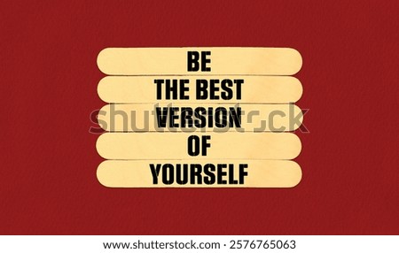 Concept word Be The Best Version of Yourself on beautiful wooden stick. Beautiful Red Chart Paper Background. Business and Be The Best Version of Yourself concept. Copy space