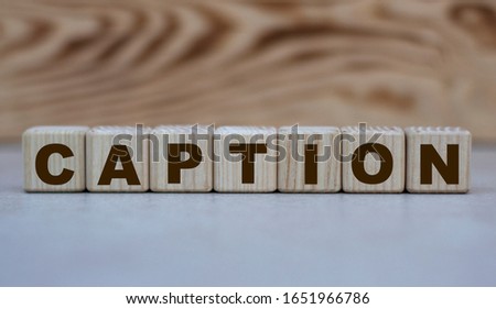 concept word caption on cubes on a beautiful wooden background