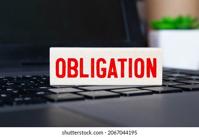 concept word obligation on cubes on a beautiful gray blue background. - Shutterstock ID 2067044195