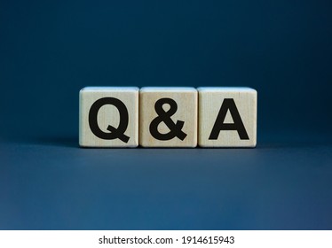 Concept word 'Q and A' on cubes on a beautiful grey background. Business concept, copy space.