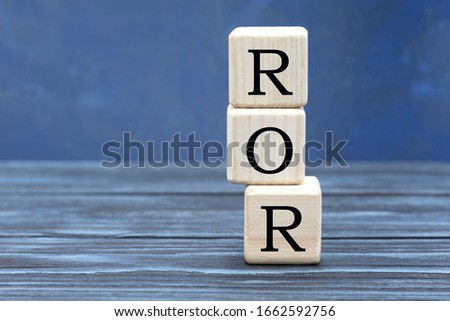 concept word ROR on cubes on a beautiful gray blue background