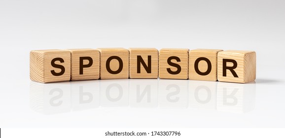 concept word sponsor inscription on wooden cube blocks on white glossy background with reflection