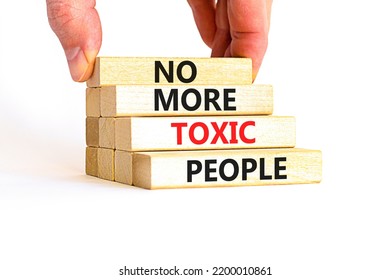 Concept Words No More Toxic People On Wooden Blocks On A Beautiful White Table White Background. Psychologist Hand. Business, Psychological No More Toxic People Concept.