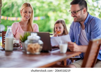 Concept of work from home.Dad and mom work from home, using laptop.