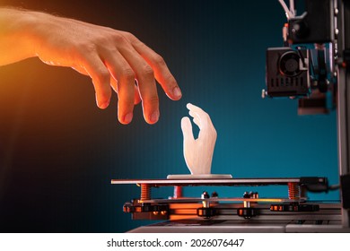 Concept of work technology and new technologies. 3d printed hand model. Biblical motives touching God.High quality photo