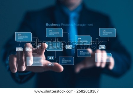 Concept of workflow optimization, automation, and strategic. Businessman interacting with a digital flowchart for business process management, featuring data boxes and decision branches. operations