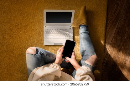 The Concept Of Working Outside The Office. An Overhead View Of A Female Freelancer Working On A Laptop At Home.	