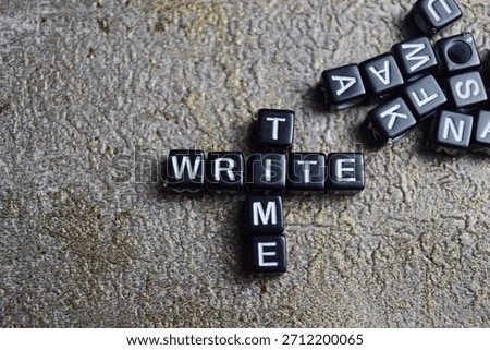 Concept of write time words arranged with on wooden letter blocks.