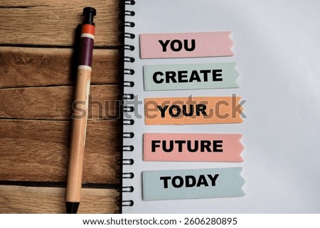 Concept of You Create Your Future Today write on sticky notes isolated on Wooden Table.