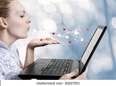 Concept - Young Cute Woman Love Laptop Computer Or Internet Boyfriend. She Sending Air Kiss To Dating Site. Blogger