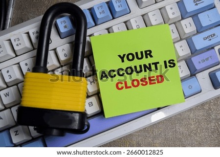 Concept of Your account is closed write on sticky notes isolated on Wooden Table.