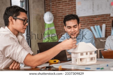 Concepts Architecture and engineer, Engineering, Design, Planning. Businessman and architech meeting for planing and checking house design and house model and secretary takes notes meeting.