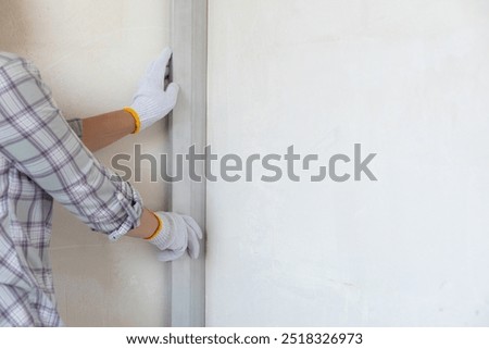 Concepts of checking the evenness of a wall using a rule. Concepts of checking the evenness of walls.