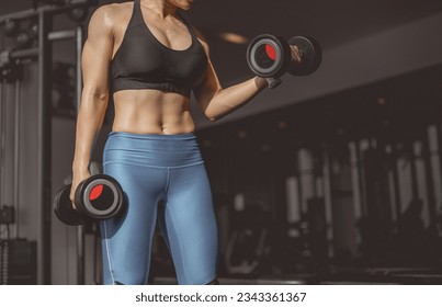 Concepts healthy lifestyle and workout. Bodybuilder, Workout, Fitness muscular body, Fitness, Gym. Fitness asian woman doing exercise and lifting dumbbells weights, bodyweight at sport gym  - Shutterstock ID 2343361367