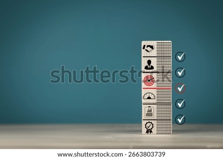 Concepts of methods for developing organizations towards success. Business icons on wooden blocks represent establishing strategy and implementing plan. with copy space