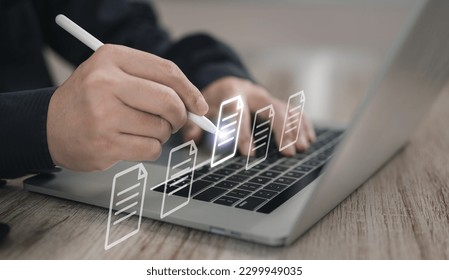Concepts of practices and policies Company articles association forTerms and Conditions : Businessman using stylus pen to select electronic document on a digital document in a virtual screen to read.