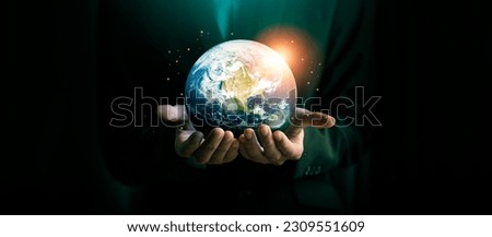 Concepts to Reduce CO2 Emissions, Global Warming, and Climate Change Energy Conservation, Sustainable Development, Earth Day.
Earth was holding in human hands. Elements of this image furnished by NASA