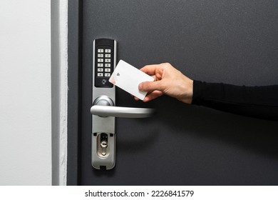 Concepts of self check-in with modern security system. Cropped shot of woman using plastic card to opened the door in hotel room. Keyless lock, wireless technology and temporary codes for entrance