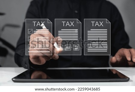 Concepts of statistical analysis and digital archiving. business document storage Custom tax payer concept Examination of documents related to tax payment Businessman filling out and calculating tax 
