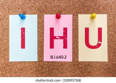 Conceptual 3 letters keyword IHU (COVID-19 Variant) on multicolored stickers attached to a cork board. New Coronavirus IHU Variant B.1.640.2 was detected in southern France in late 2021.
