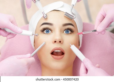 Conceptual beauty and cosmetology image of the hands of several beauticians holding their respective equipment. Beauty concept. Cosmetology concept. Cosmetology salon. Cosmetic procedures mesotherapy - Powered by Shutterstock