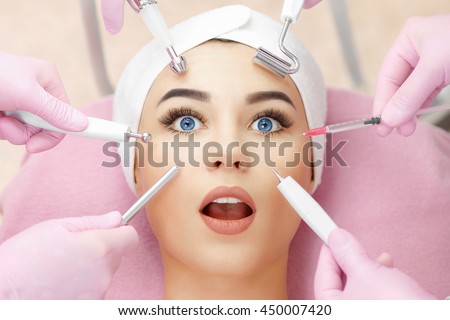Conceptual beauty and cosmetology image of the hands of several beauticians holding their respective equipment. Beauty concept. Cosmetology concept. Cosmetology salon. Cosmetic procedures mesotherapy