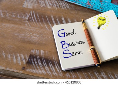 Conceptual Business Acronym GBS Good Business Sense. Retro Effect And Toned Image Of A Fountain Pen On A Notebook