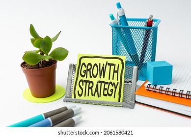 Conceptual caption Growth Strategy. Business concept Strategy aimed at winning larger market share in shortterm Tidy Workspace Setup Writing Desk Tools And Equipment Taking Notes - Shutterstock ID 2061580421