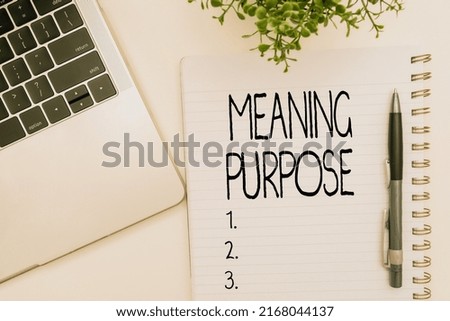 Conceptual caption Meaning Purpose. Internet Concept The reason for which something is done or created and exists Office Supplies Over Desk With Keyboard And Glasses And Coffee Cup For Working