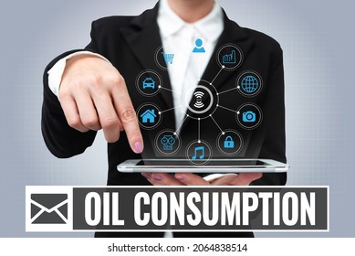 Conceptual caption Oil Consumption. Internet Concept This entry is the total oil consumed in barrels per day Lady Uniform Standing Tablet Hand Presenting Virtual Modern Technology